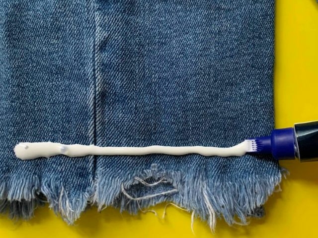 How to fix ripped jeans with fabric glue and a decorative patch