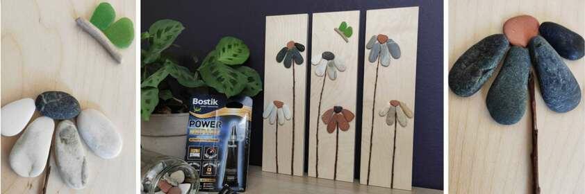 Ξύλινη βάση με λουλούδια από βότσαλα και κλαδιά δίπλα σε κόλλες Bostik, παρουσιάζοντας τα υλικά για τη δημιουργία του DIY κάδρου.