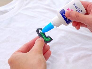 Applying Bostik Fabric Glue to a fabric patch