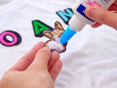 Applying Bostik Fabric Glue to a fabric applique