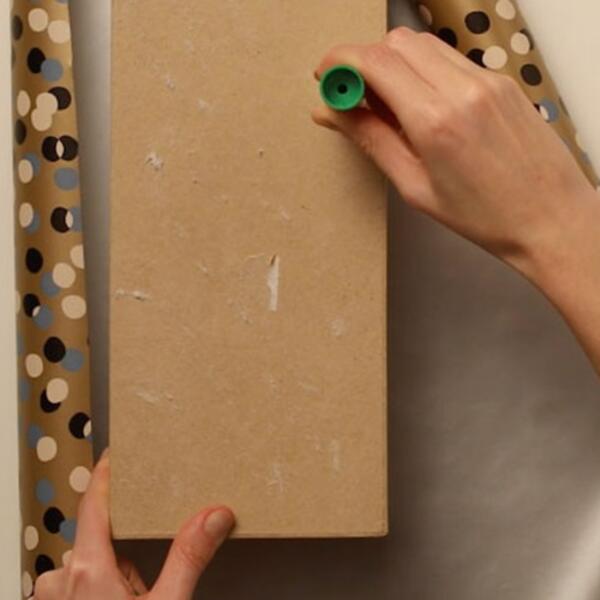 Applying glue to a cardboard storage box