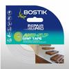 Bostik Anti-Slip Grip Tape in clear, shown in retail packaging with a visible transparent roll and an application image of wooden indoor stairs. The tape measures 5 metres by 48 millimetres and provides discreet slip resistance for smooth surfaces without altering the appearance.